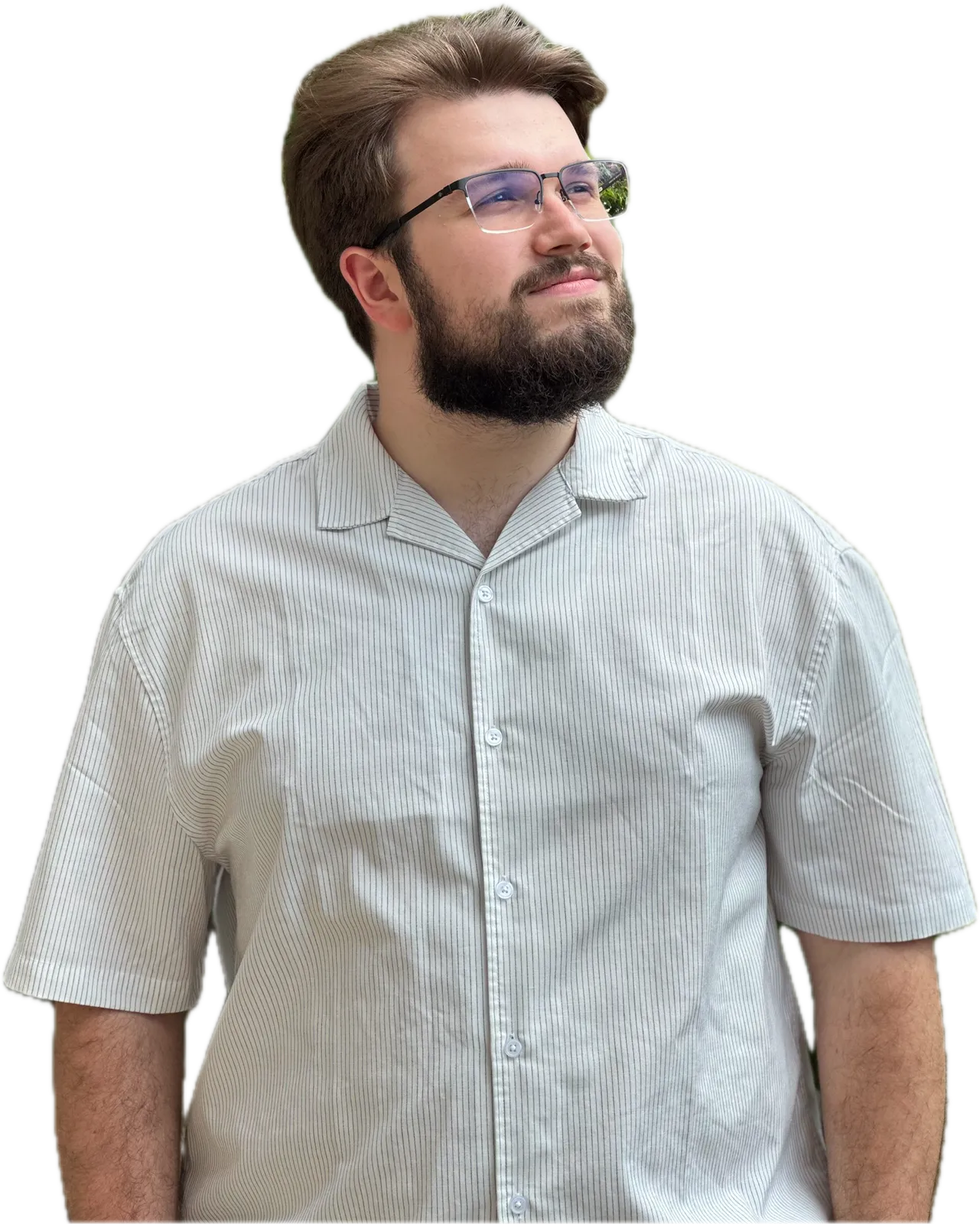 Vuk Aranđelović in a light short-sleeved shirt, looking up and to the side
